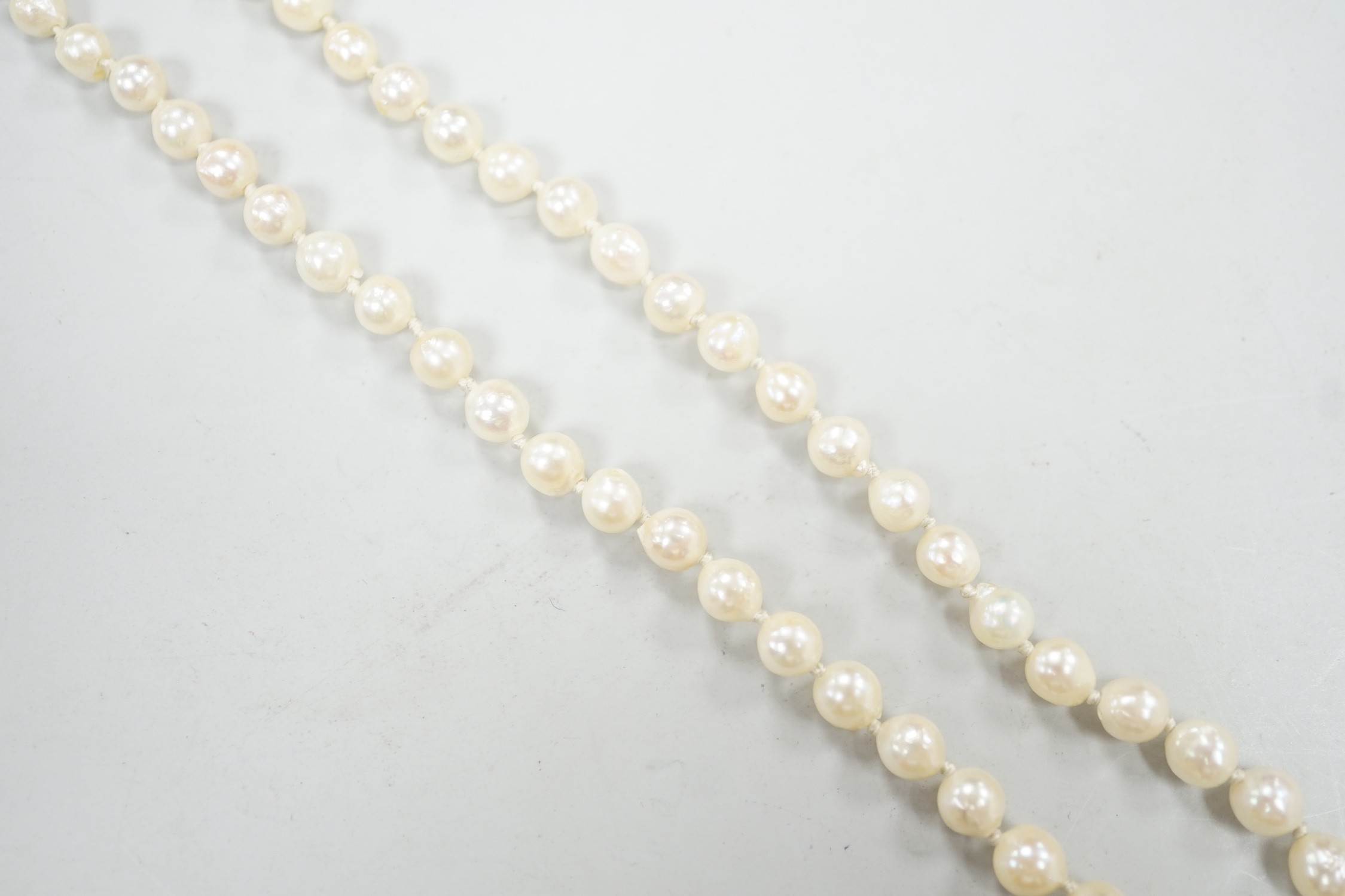 A single strand culture pearl necklace, with paste set sterling clasp, 38cm.